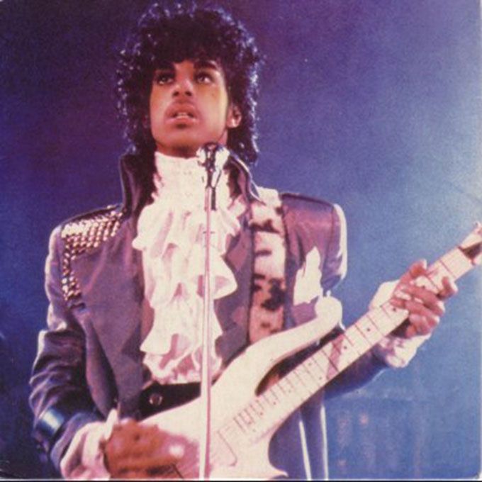 Prince singing Purple Rain in ruffles and curls. Pic: Purplerrain.tumblr.com