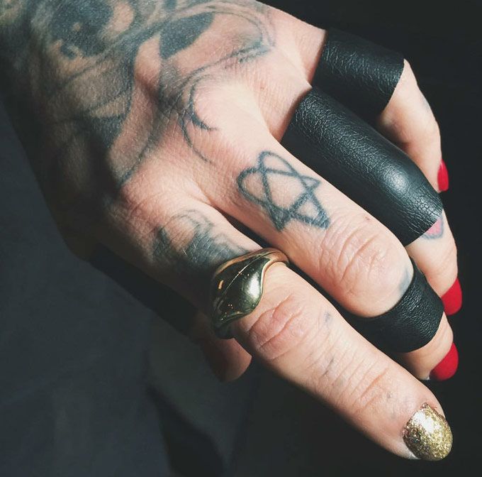 Like tattoo artist, Kat Von D, find cool black leather and little army themed accessories to add little details to your look, (Source: @thekatvond on Instagram)
