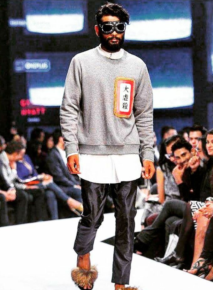 Basic grey jumper with strong army motifs from the orient. (Source: @himanshu0066 on Instagram)