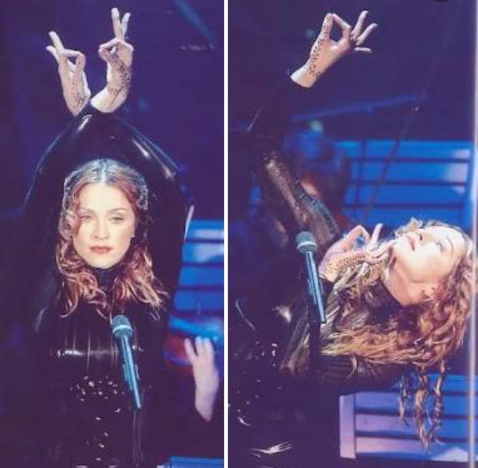 Madonna performs desi moves with her henna adorned hand.