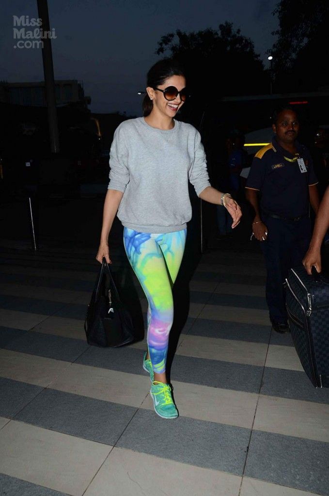 Deepika Padukone teamed her grey sweater with printed tights in a burst of neon tones.