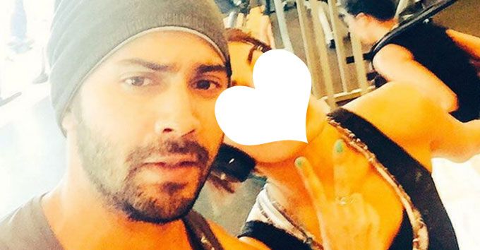 Can You Guess Who This Bollywood Hottie Is In Varun Dhawan’s Gym Selfie?
