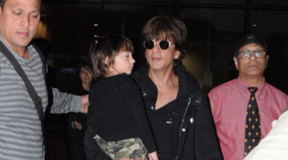 In Photos: Shah Rukh Khan Returns From London With A Sleepy AbRam In Tow