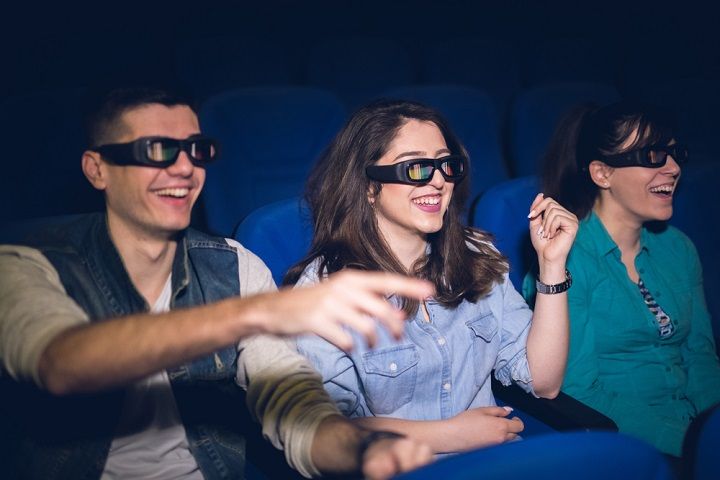 Watching A Movie (Image Courtesy: Shutterstock)
