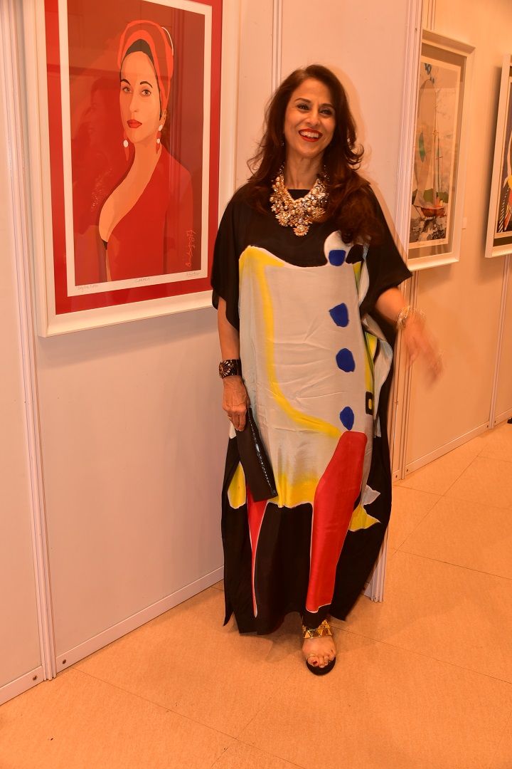 Shobhaa De poses with her portrait painting