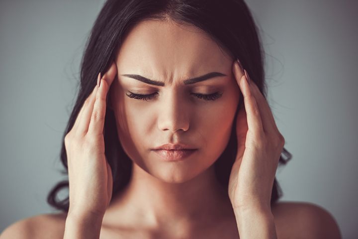 Woman Suffering From A Headache (Image Courtesy: Shutterstock)