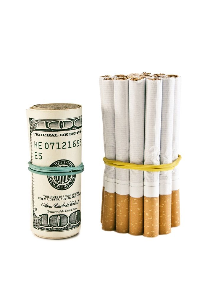 Cigarettes And Money (Image Courtesy: Shutterstock)