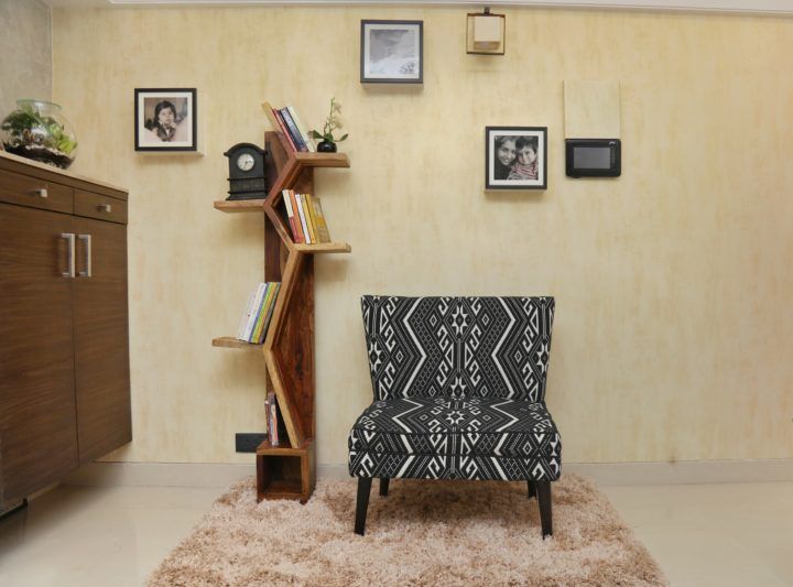 Accent Chair, Book Shelf and Rug from Pepperfry