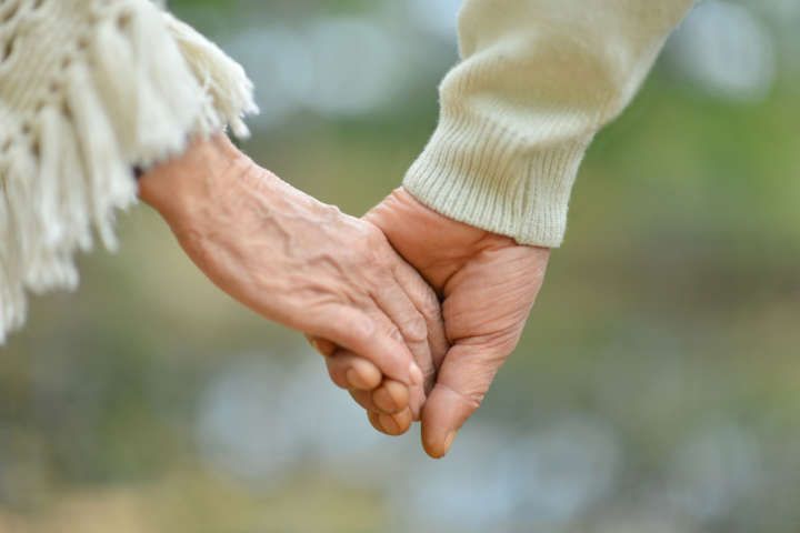 Grandparents Holding Hands (Image Courtesy: Shutterstock)