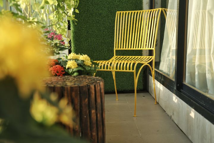 Yellow metal garden chair