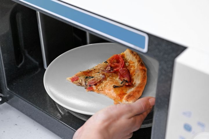 Pizza In A Microwave By Africa Studio | www.shutterstock.com