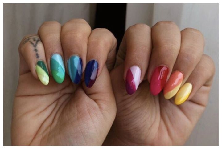 Premium Photo | A colorful nail art design with a multicolored design on it