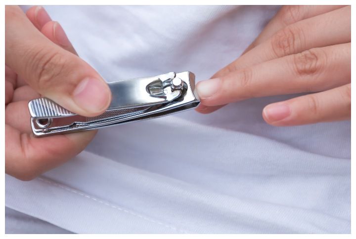 Using a nail clipper to cut the nails, Healthy Nails short for good hygiene by BK_graphic | www.shutterstock.com