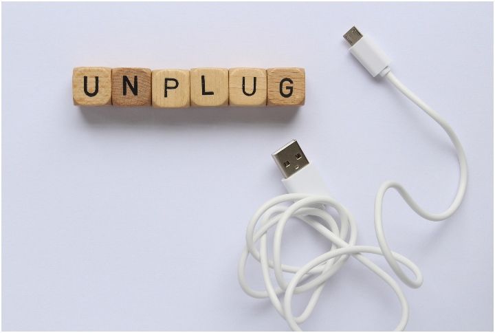 'Unplug' printed on wooden blocks with a connectivity cable by Michelle Patrick | www.shutterstock.com