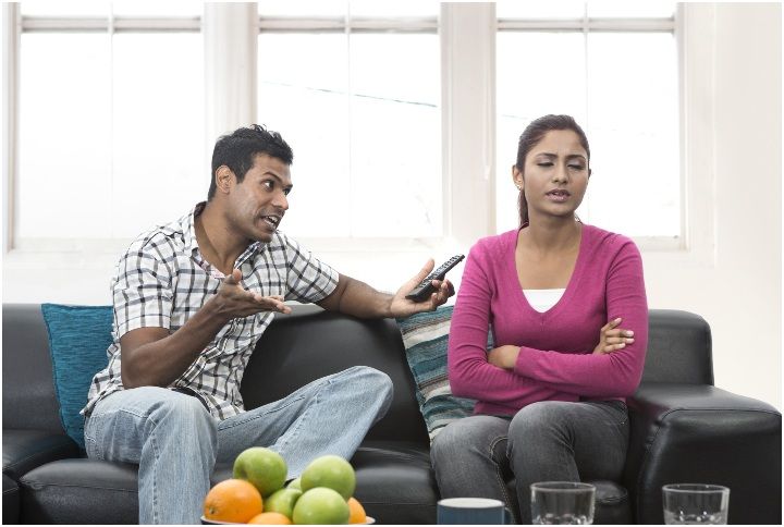 Angry Indian couple having an argument in their living room by Stuart Jenner | www.shutterstock.com