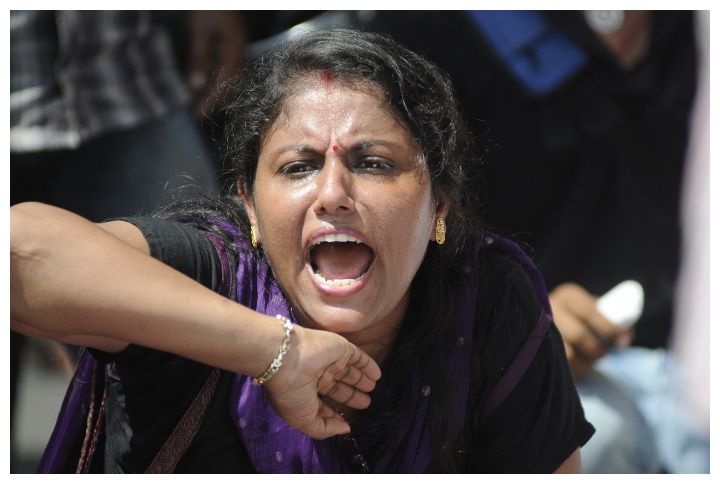KOLKATA- SEPTEMBER 18: An angry Bengali woman shouting slogans during a student protest rally organized by Jadavpur university students against police atrocities on September 18,2014 in Kolkata,India by arindambanerjee | www.shutterstock.com