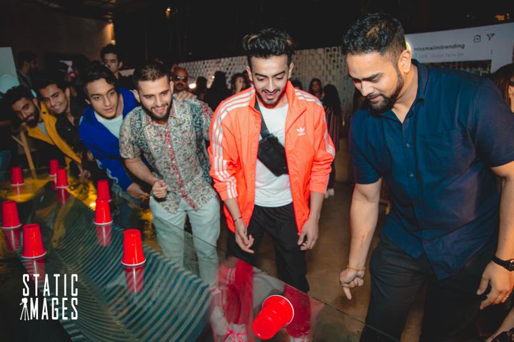 Guests playing Flip Cup at the MissMalini Trending launch party