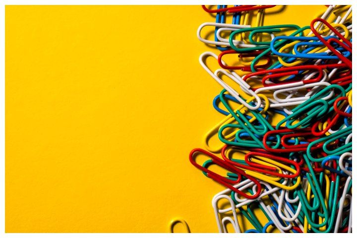Pile of paperclips on a yellow background by elvis901 (Source: www.shutterstock.com)