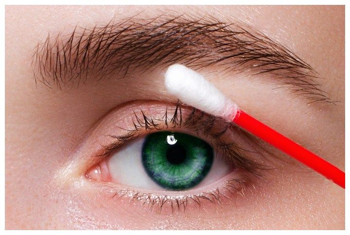 Using Q-tips to remove makeup by Shtennikova Evgenia | www.shutterstock.com