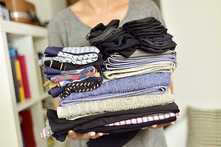 A Pile Of Folded Clothes by Nito | www.shutterstock.com