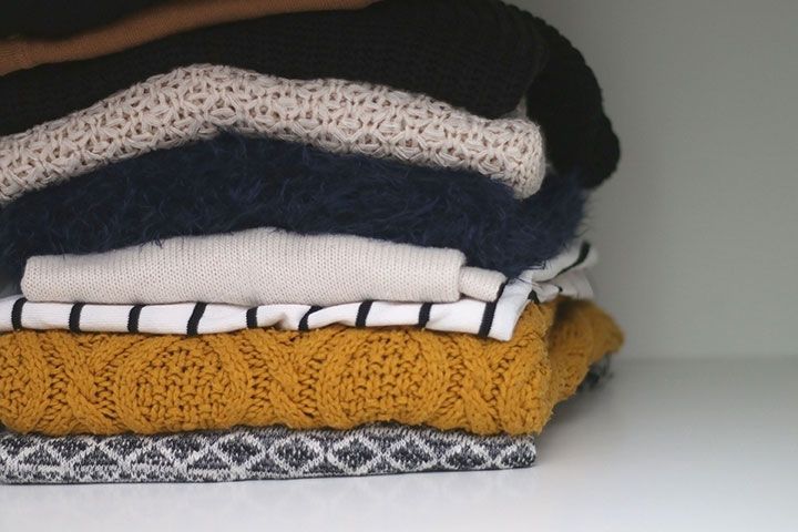 A Pile Of Folded Knitwear by Jelena990 | www.shutterstock.com