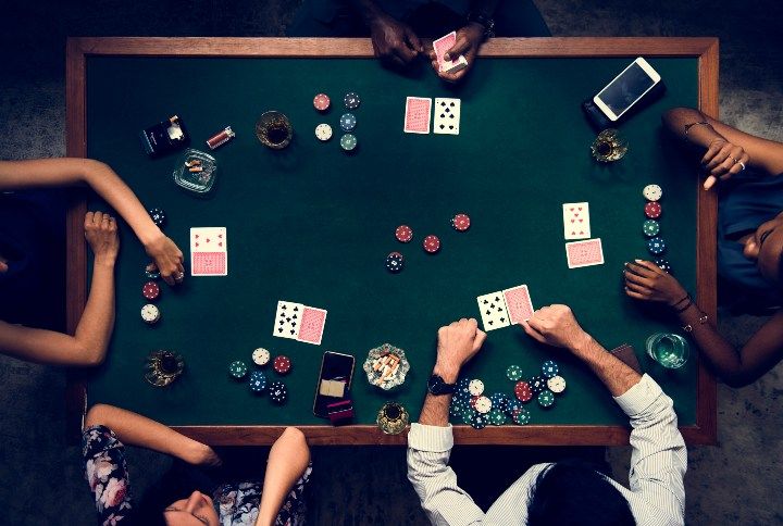 Aerial of people playing gamble in casino By Rawpixel.com | www.shutterstock.com