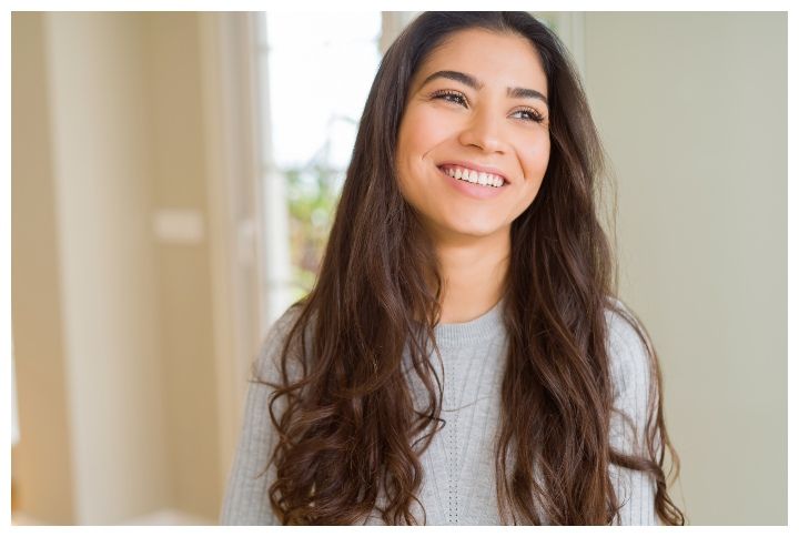 Beautiful brunette woman smiling cheerful, looking happy and positive via Krakenimages.com (Source: Shutterstock)
