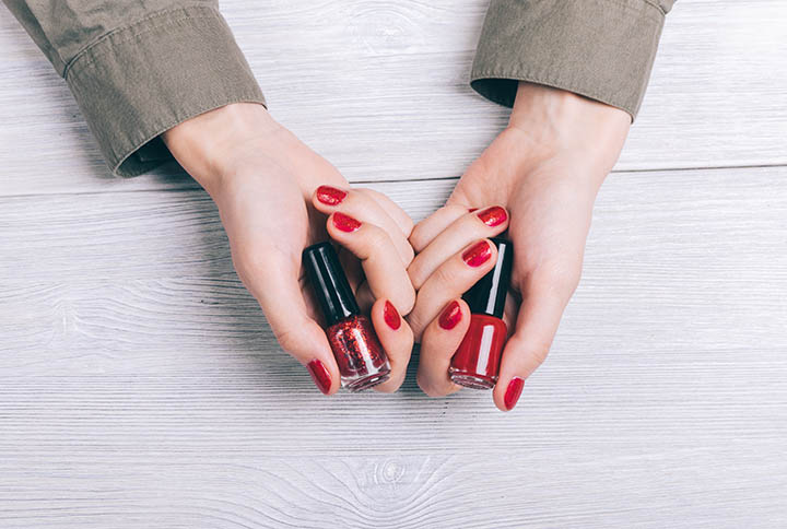 Red Nail polish In Female Hands By ProgressMan | www.shutterstock.com