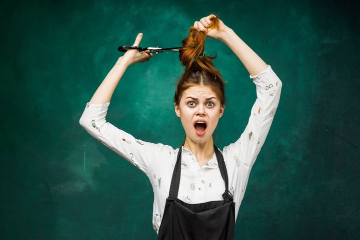 Trying to trim your own hair By nelen | www.shutterstock.com