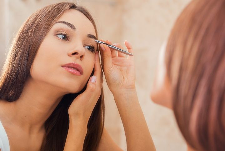 How To Make Tweezing Your Eyebrows At Home Less Painful