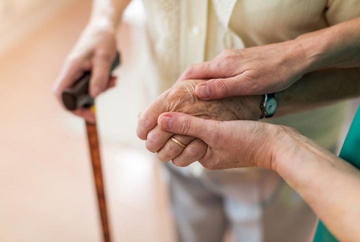 Nurse Holding Hand Of A Senior Man By pikselstock | www.shutterstock,co