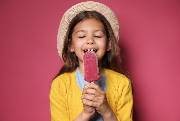 Little Girl Eating Ice-Cream By New Africa | www.shutterstock.com