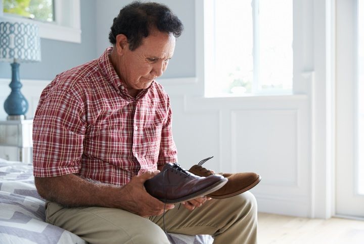 Senior Man With Dementia Trying To Dress By Monkey Business Images | www.shutterstock.com