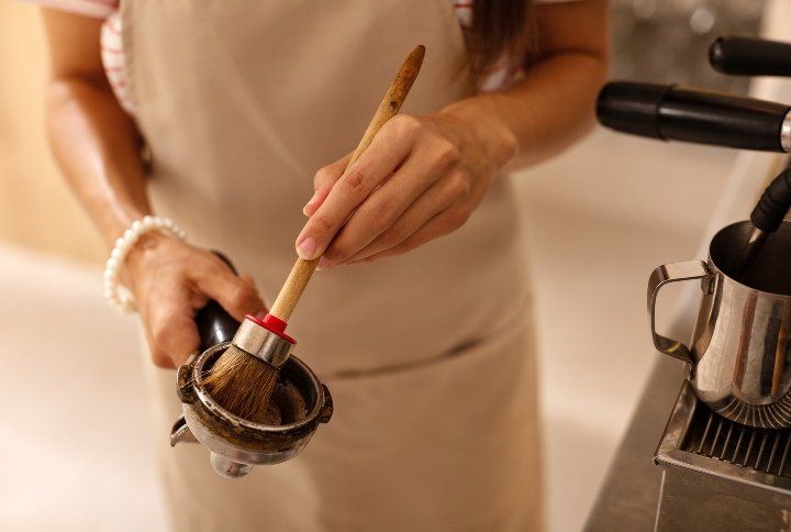 Cleaning coffee filter By YAKOBCHUK VIACHESLAV | www.shutterstock.com