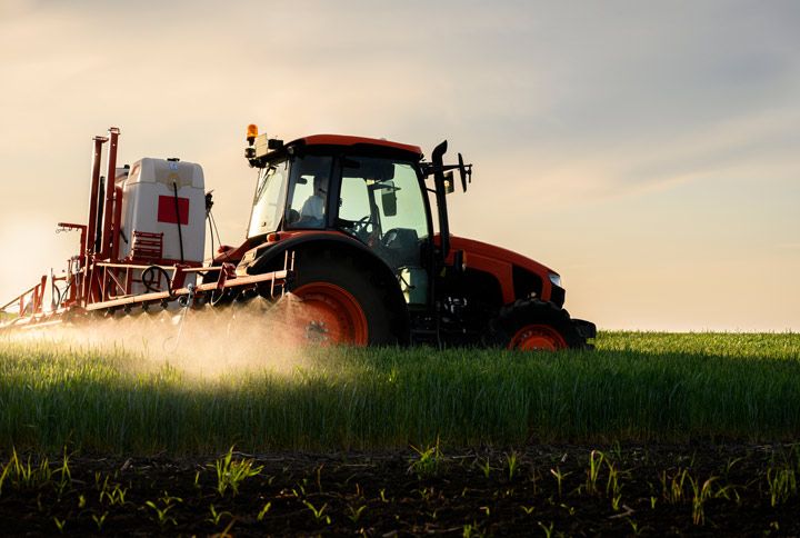 Spraying Pesticides by Fotokostic | www.shutterstock.com