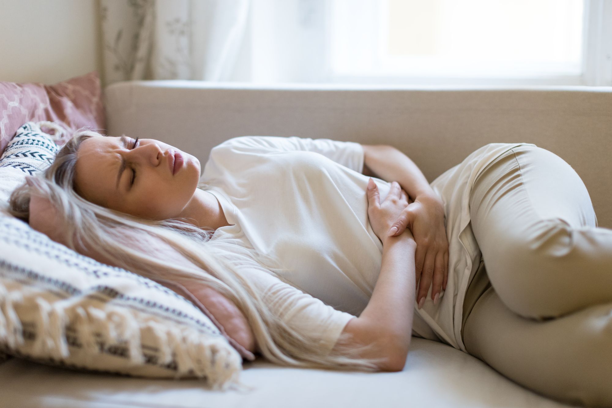 Woman With Gastrointestinal Issues By DimaBerlin | www.shutterstock.com