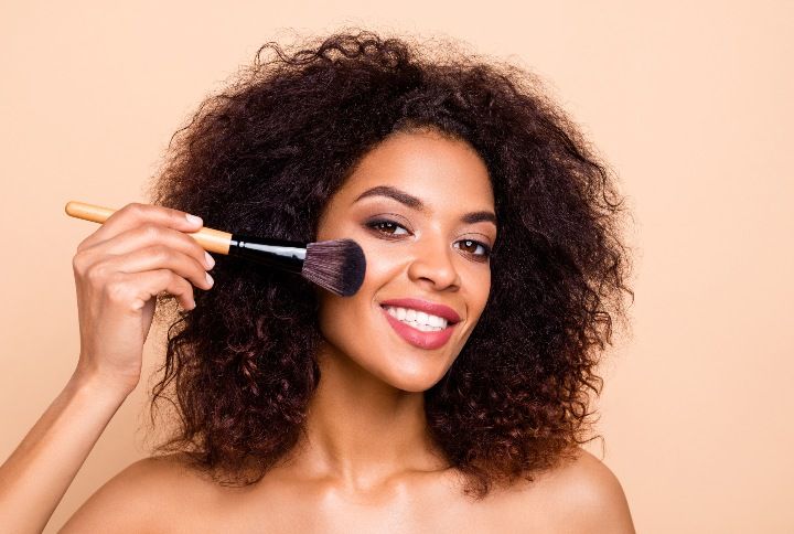 Beautiful Dark Skin Woman With Makeup Brush By Roman Samborskyi | www.shutterstock.com