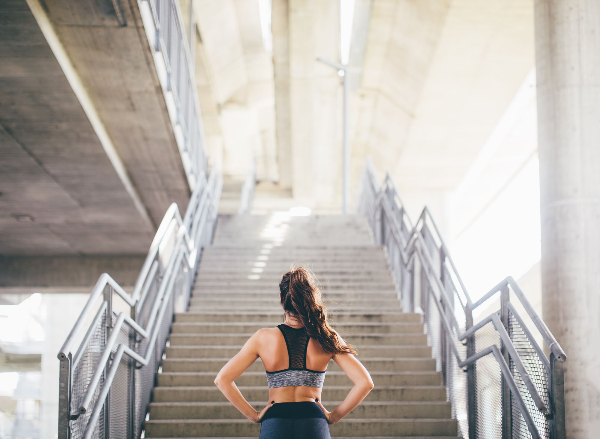 Young woman working out By astarot | www.shutterstock.com