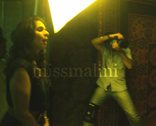 Anita Dongre advises the actress on her pose, while Vikram Bawa shoots her.
